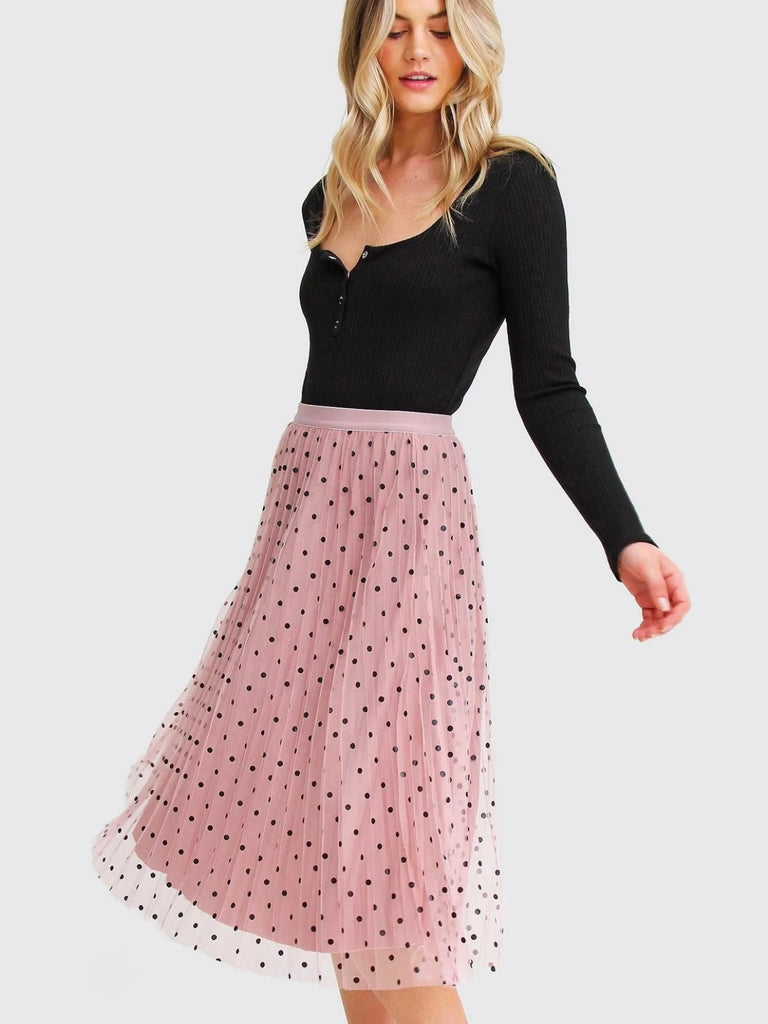 Pink Reversible Skirt, with two stunning looks in one: luxurious velour pleats on one side for an elegant touch, and playful polka-dotted tulle on the reverse side, and features a flared cut and elastic waistband.