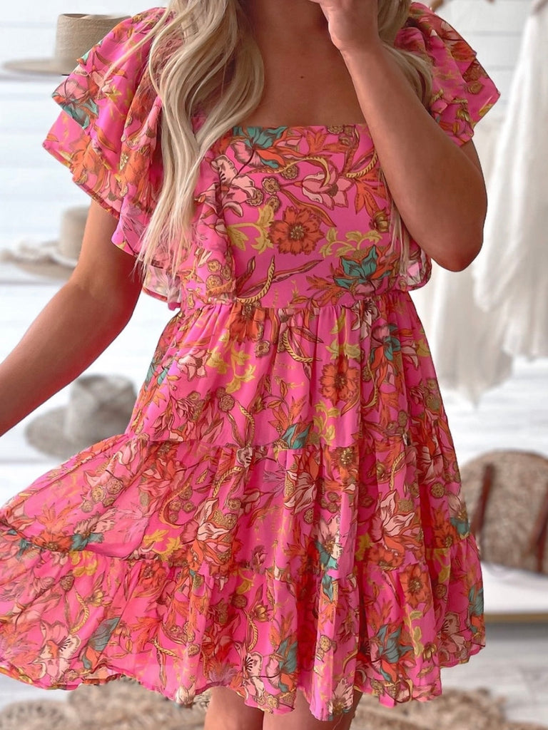  Ruffle Sleeve and  tiered design , peachy pink colour dress  with floral print and low square neck.