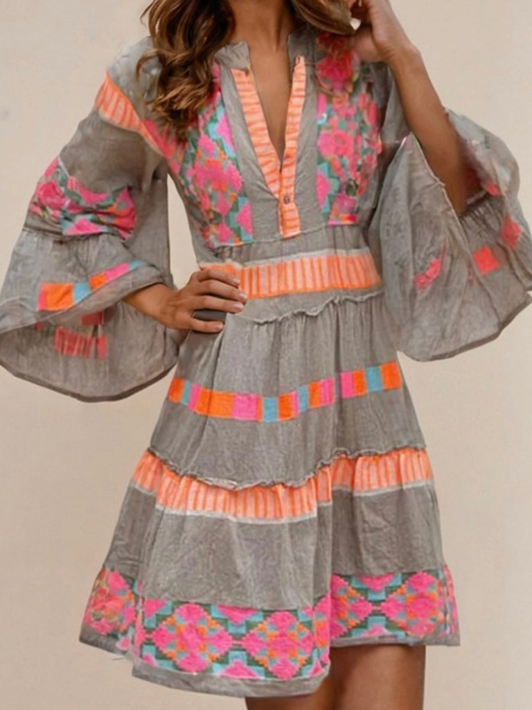 Mini dress with  Three-quarter length bell sleeves, and Intricate ethnic geometric pattern in grey, orange, pink, green, and blue.