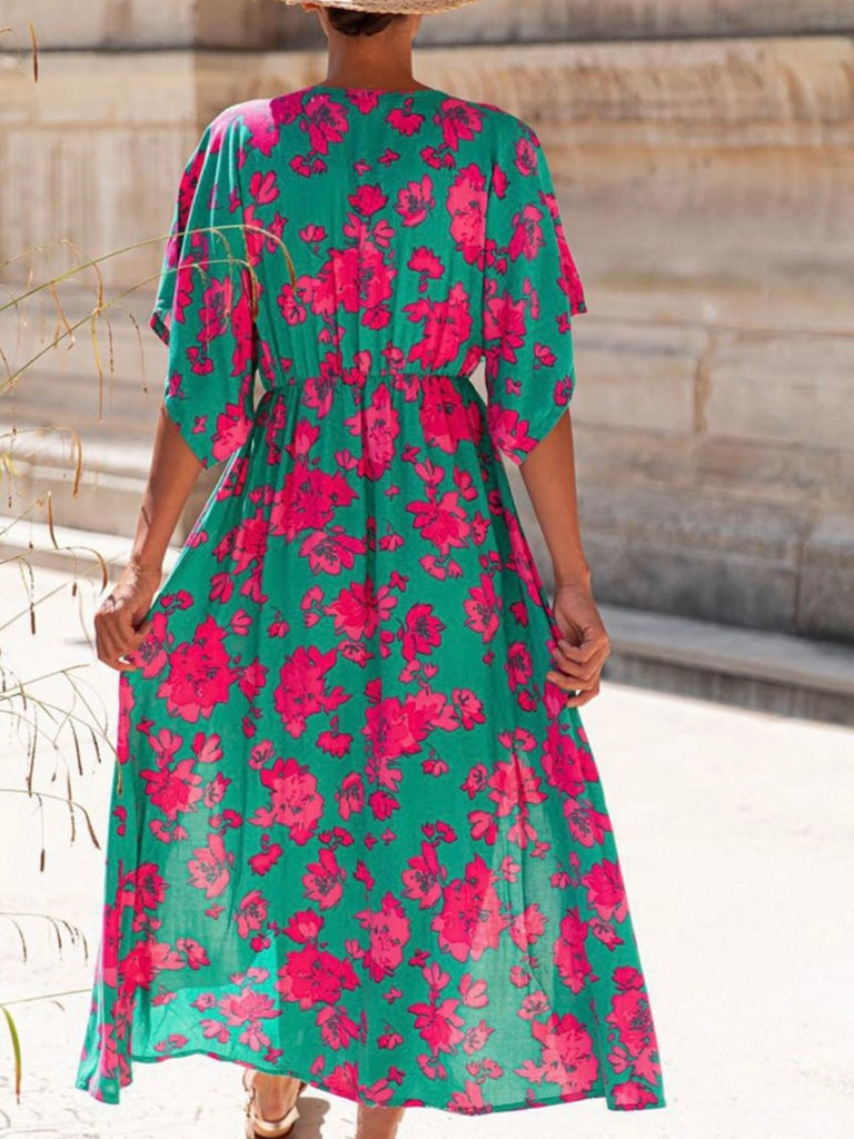 Sea Green hue and vibrant Pink Red floral print Maxi-Dress with a Flattering v-neck and flutter sleeves and slits at the hemline.