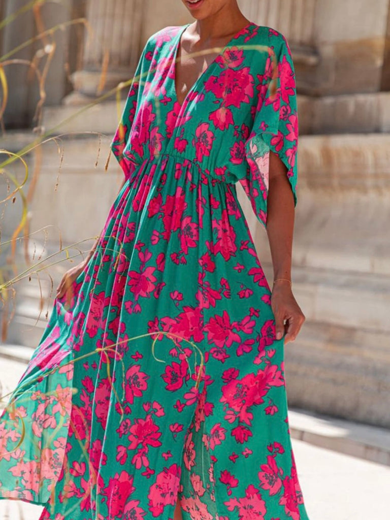 Sea Green hue and vibrant Pink Red floral print Maxi-Dress with a Flattering v-neck and flutter sleeves and slits at the hemline.