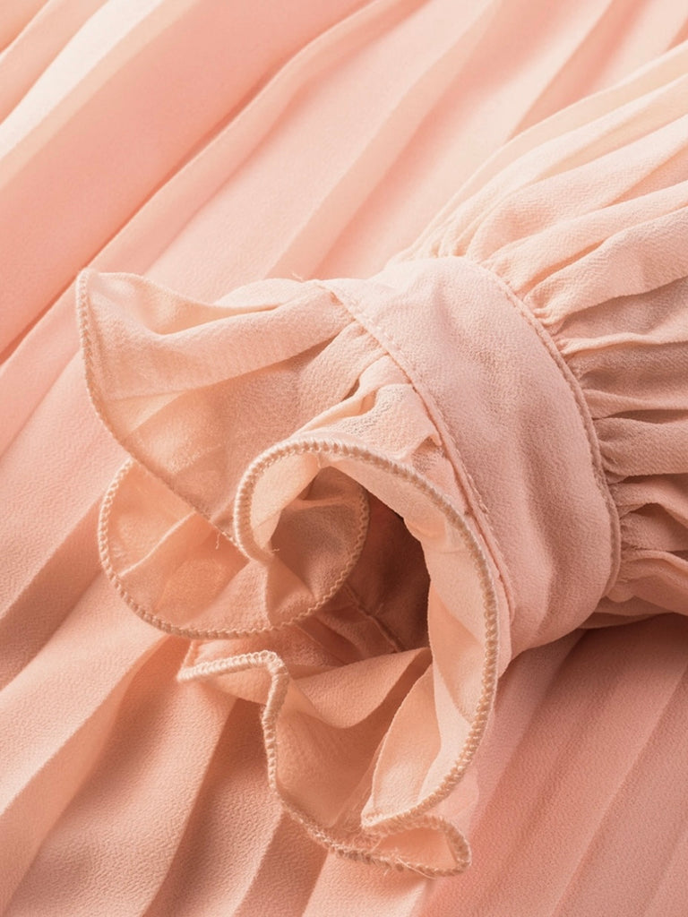 Playful V-neck Pink Pleated Romper Dress features a tie waist with a buttoned front, and frilly sleeves.