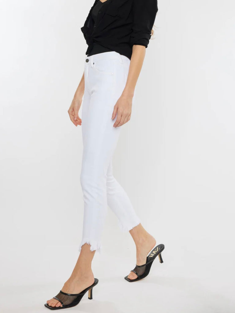 White Kancan Raw Hem  ankle-length skinny jeans featuring an asymmetrical raw cut hem and Single button front closure, Zip fly.