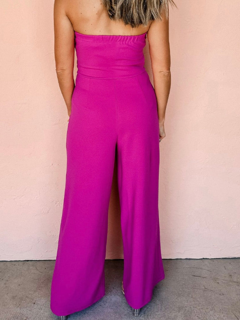 Solid magenta pink colour ,wide leg cut Jumpsuit , with a  front tie bow accent, and elastic back neckline.