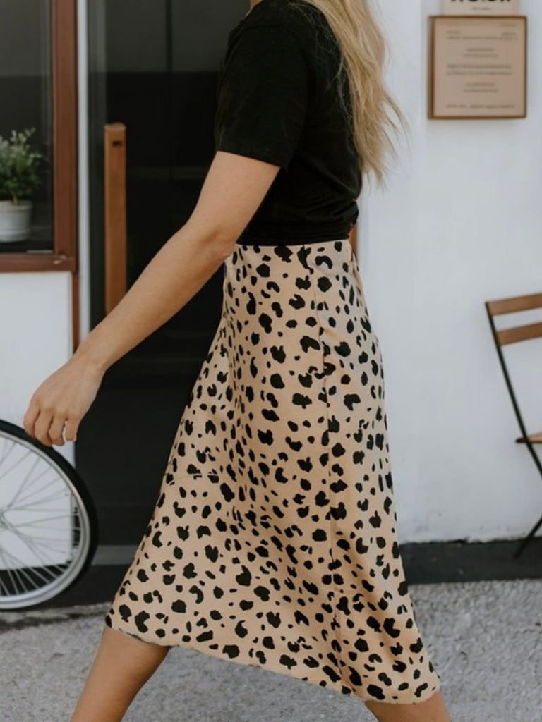 Spotted Animal Print Midi Skirt with a high waist and fit flare silhouette.