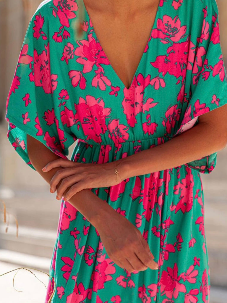 Sea Green hue and vibrant Pink Red floral print Maxi-Dress with a Flattering v-neck and flutter sleeves and slits at the hemline.