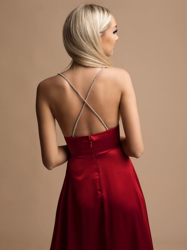 Long Red Satin Maxi -Dress features a wide waist and criss-cross strap back and plunging front v with a side slit in the skirt.