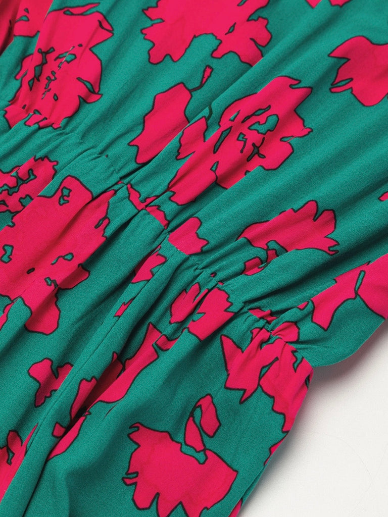 Sea Green hue and vibrant Pink Red floral print Maxi-Dress with a Flattering v-neck and flutter sleeves and slits at the hemline and elastic waist.