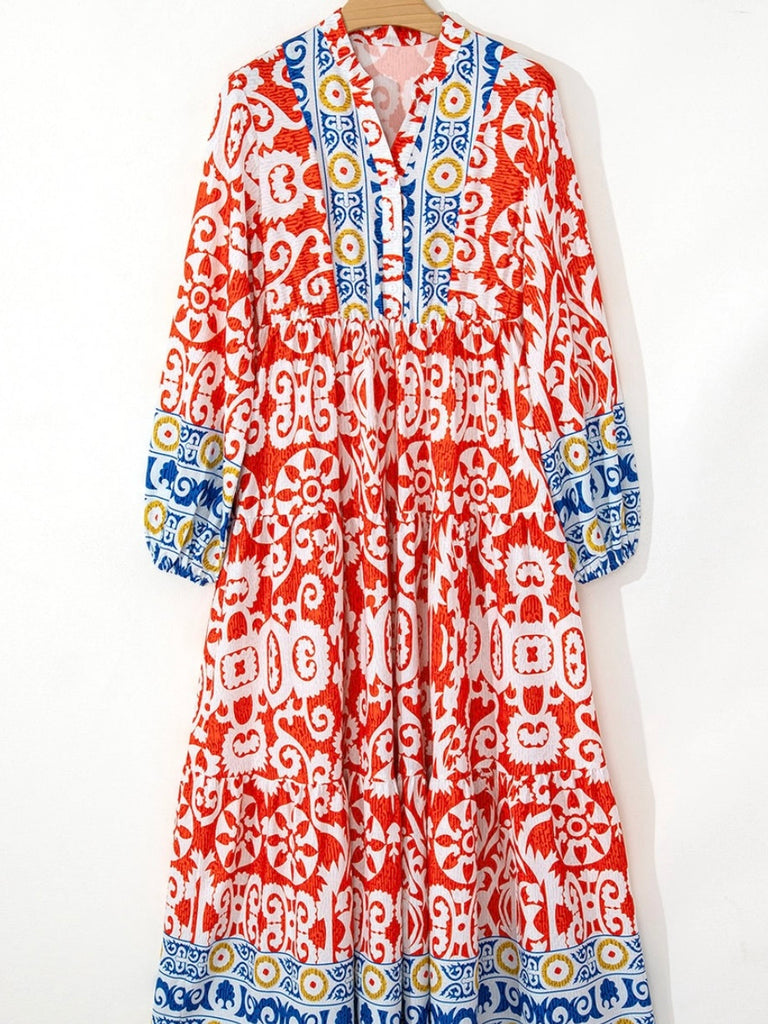  Long Boho Maxi Dress, in a beautiful Spanish print, with a Unique Geometric Pattern, accented by vibrant orangey-red and blue motifs.