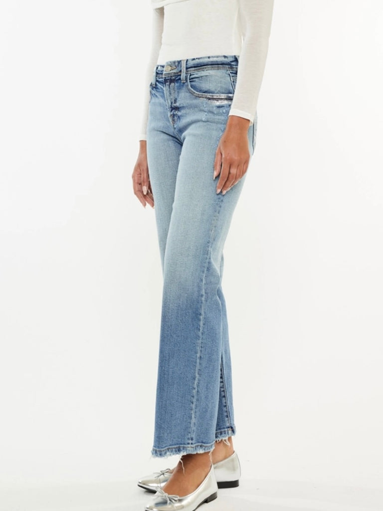 Wide Leg Kancan Jeans features whiskering, minimal distress, 5-pocket style, one button closure, and zip fly