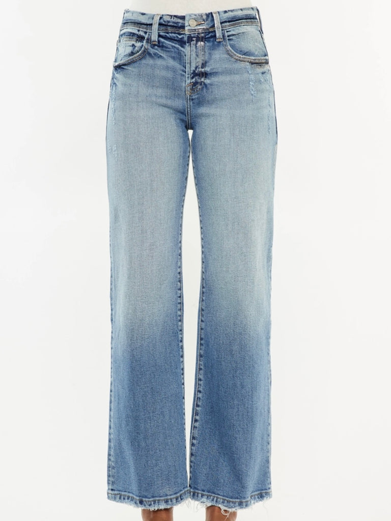 Wide Leg Kancan Jeans features whiskering, minimal distress, 5-pocket style, one button closure, and zip fly