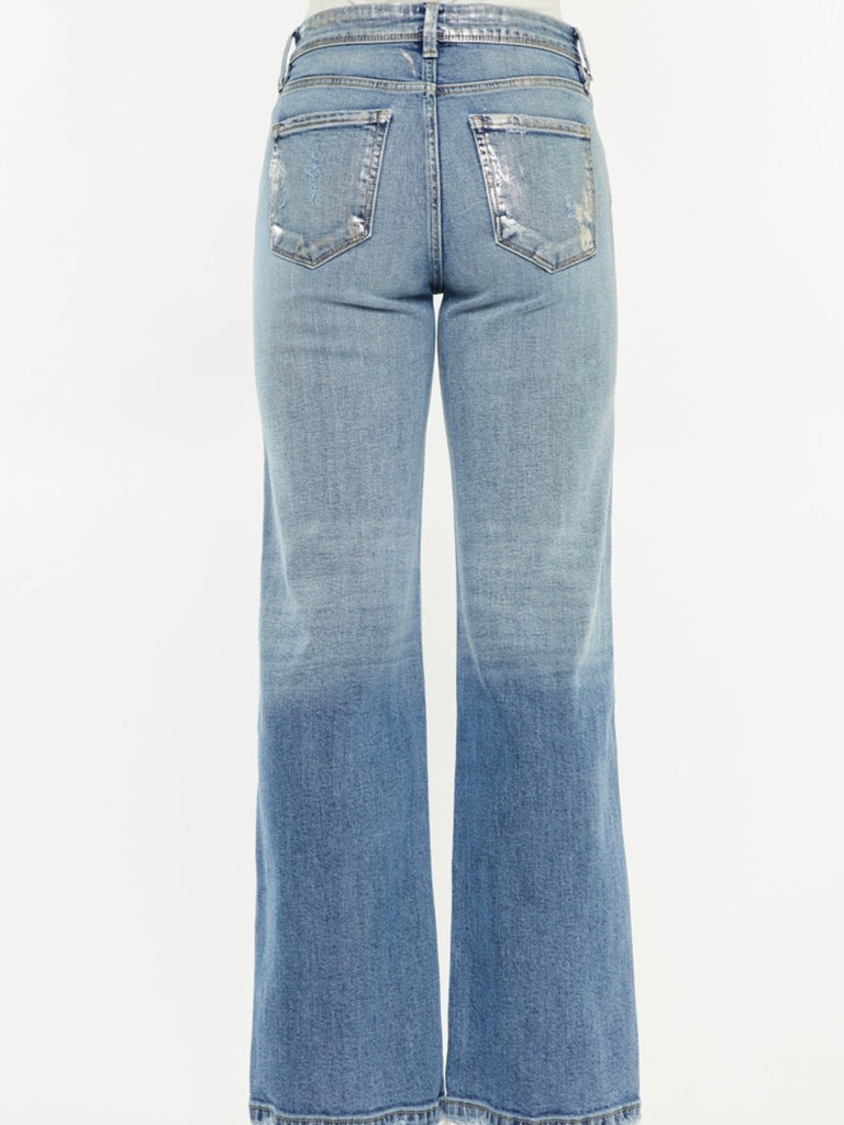 Wide Leg Kancan Jeans features whiskering, minimal distress, 5-pocket style, one button closure, and zip fly