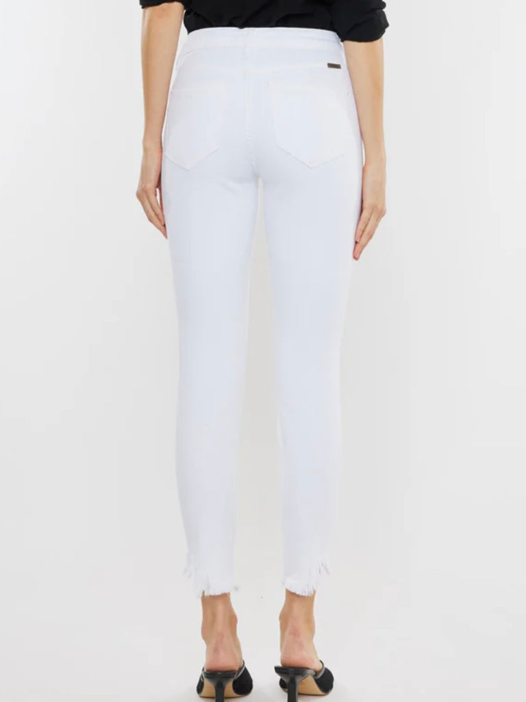 White Kancan Raw Hem ankle-length Skinny Jeans , featuring an asymmetrical raw cut hem and Single button front closure, Zip fly.