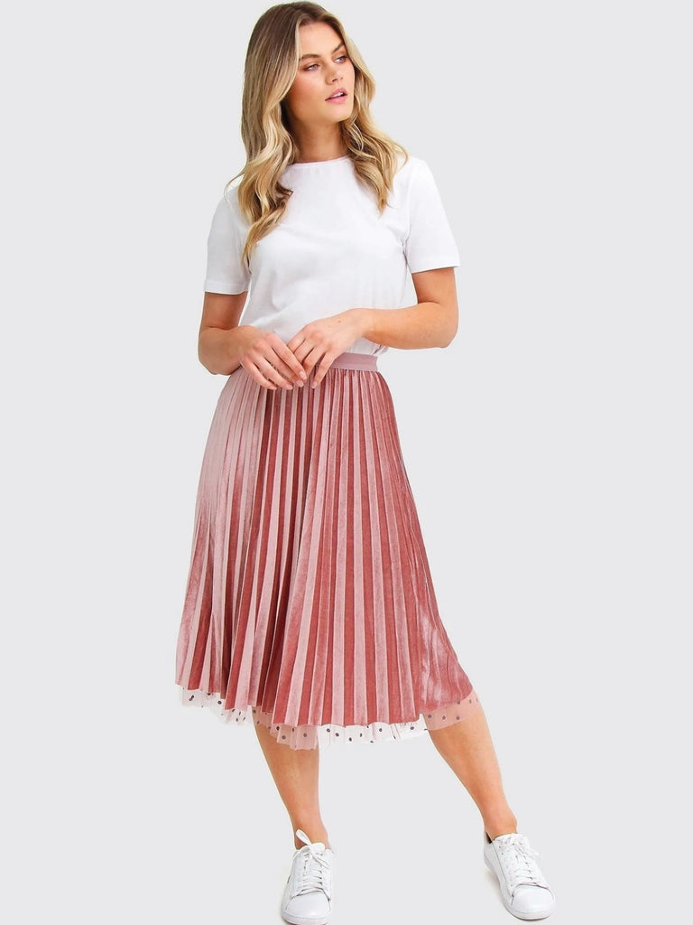 Pink Reversible Skirt, with two stunning looks in one: luxurious velour pleats on one side for an elegant touch, and playful polka-dotted tulle on the reverse side, and features a flared cut and elastic waistband.