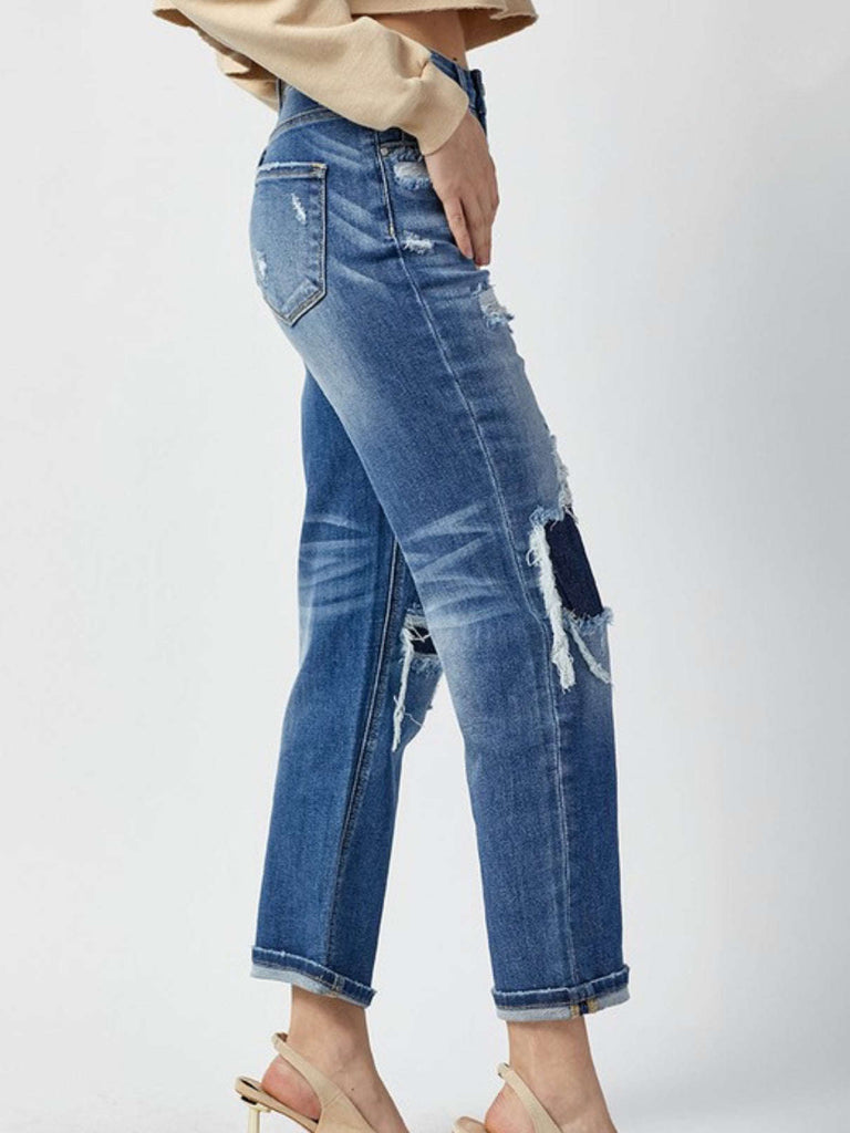 Straight Leg Jeans with Patches on the front and a distressed look , with a touch of Whisking throughout the jeans.