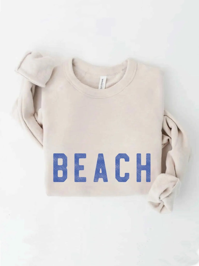 Heather Dust Beach Sweatshirt featuring ribbed cuffs and waistband, and a classic crew neck and butter-soft fabric.