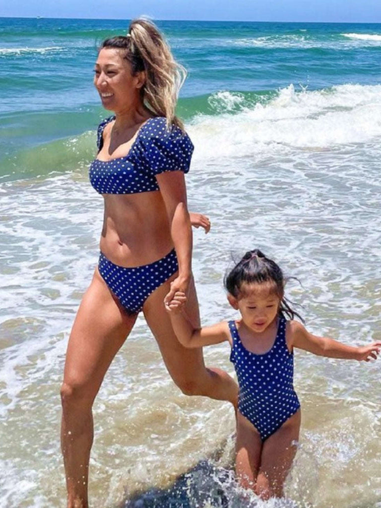 Blue  Bikini Set featuring a French Style square neck bikini top with short puff sleeves and a tie on the back and fully lined high waisted bottoms that also tie on the front.