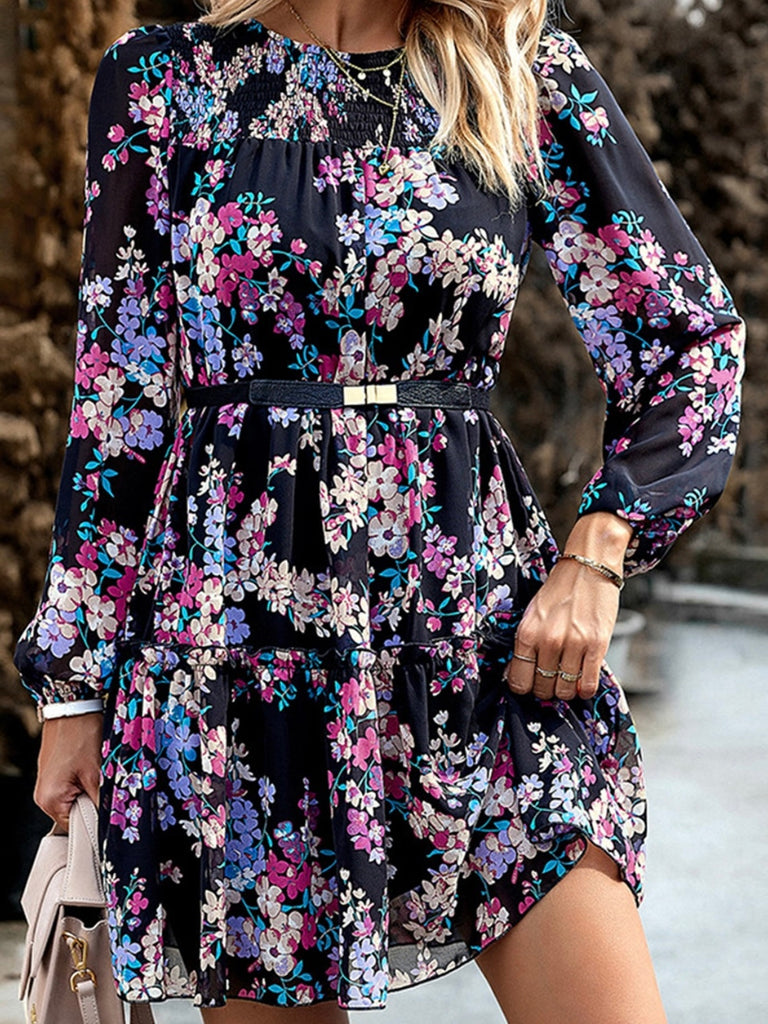 Black Midi -Length Floral Dress with purple and pink and white flowers has puff sleeves and high waist , with a smocked neckline .