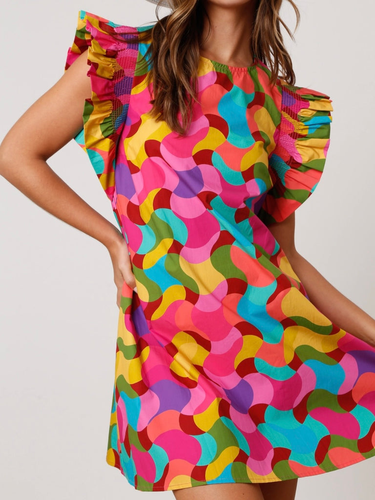 Shift Dress, featuring a vibrant geometric print ,made from soft and breathable 100% cotton, this dress also boasts smocked short ruffle sleeves.