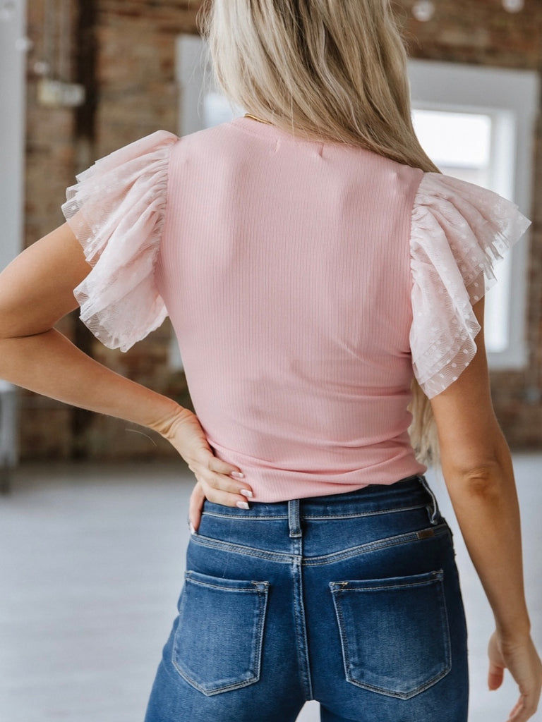 Pink Top, made with 93% viscose and 7% elastane with full ruffle dotted sleeves