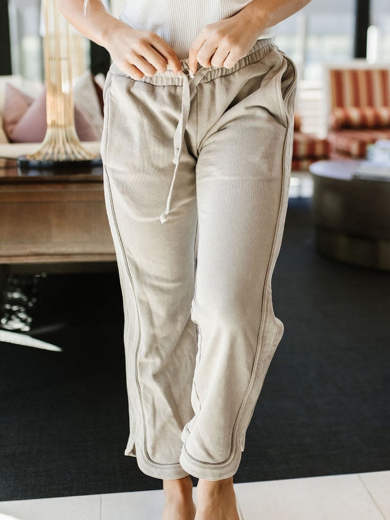 Medium Stretch Stone -Grey elastic-waisted, straight-legged pant with two side pocket and hem slits, and tie waist.