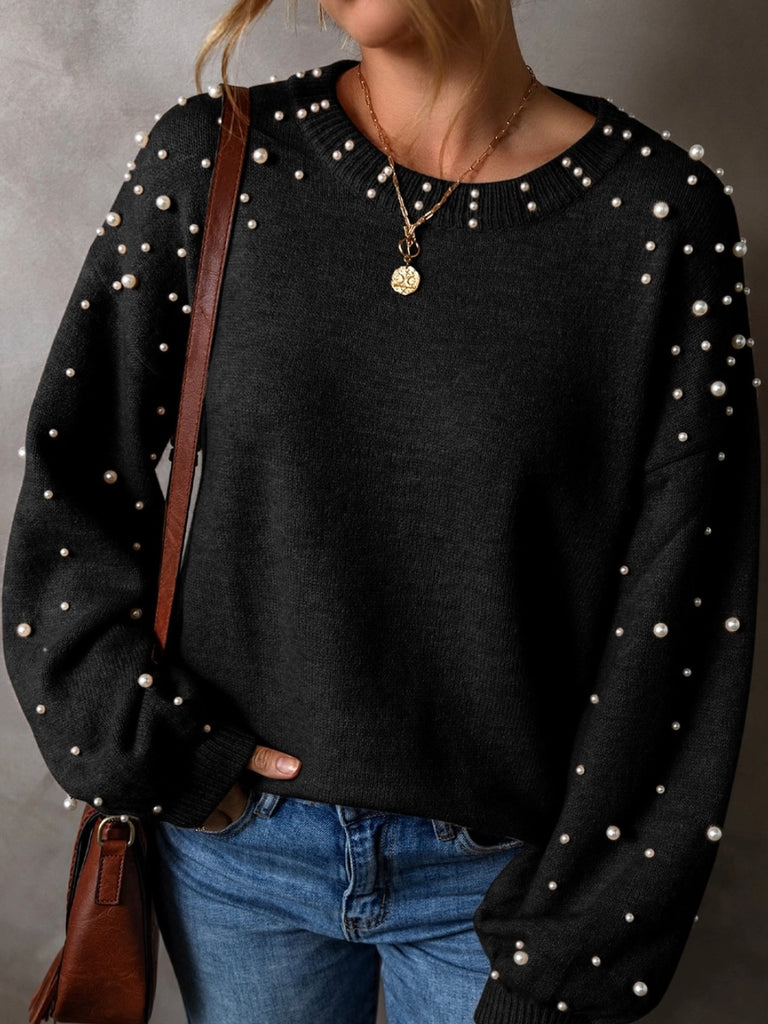 Black colour sweater with white pearls throughout, with a drop shoulder design and classic round neck .