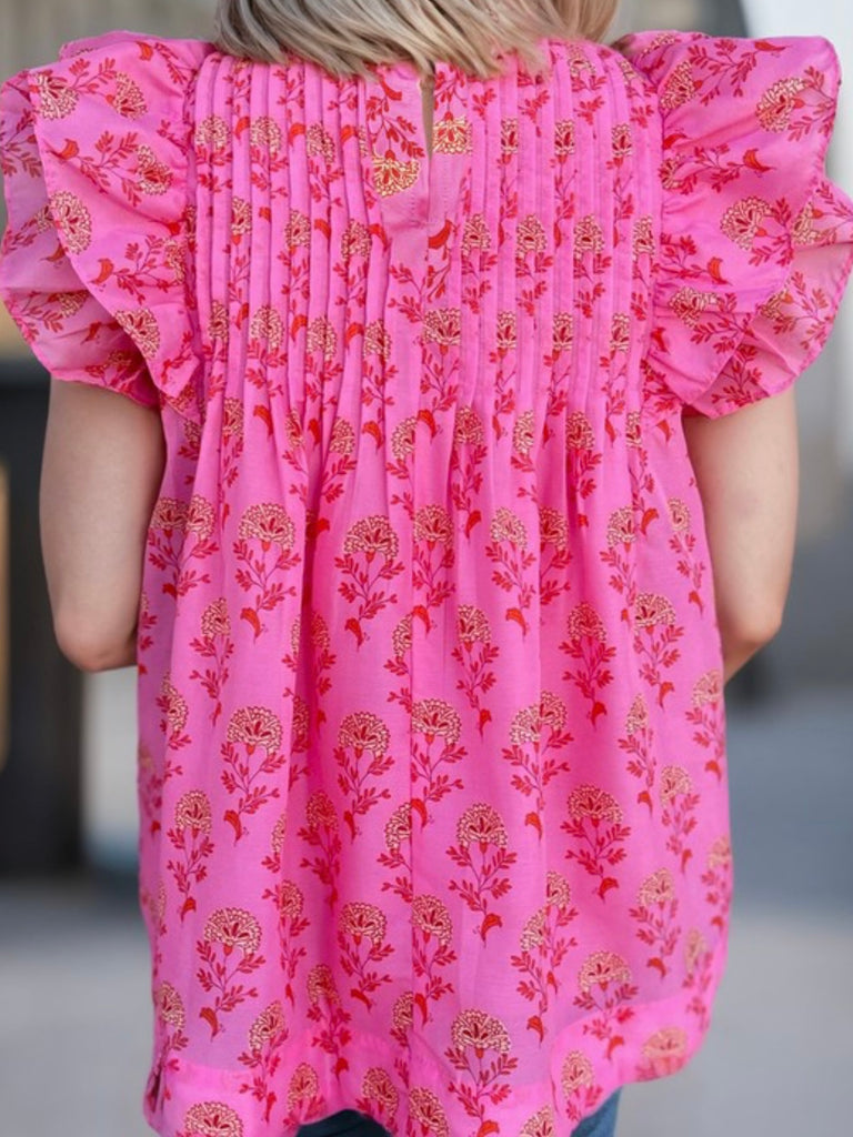 Ruffle pleated blouse in a red boho floral print.