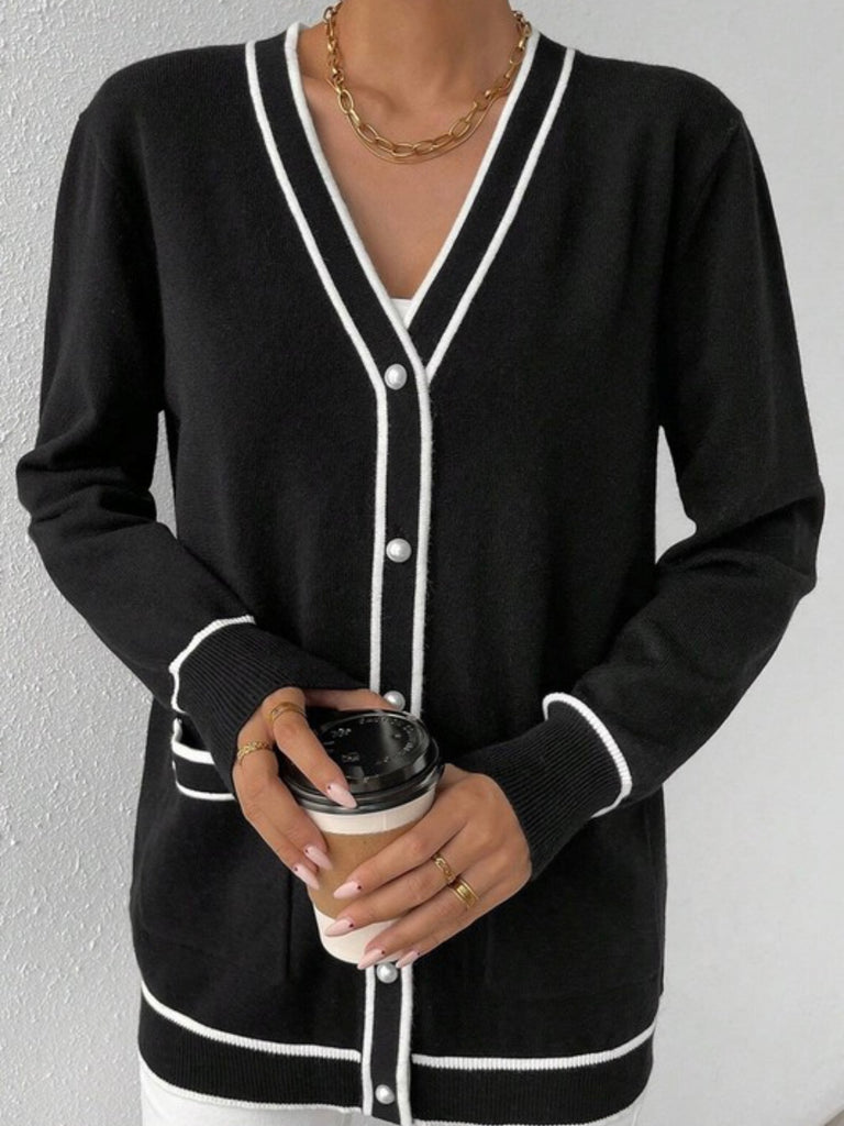 Button Front Varsity Cardigan in black with white trim and a longer fit, with front pockets.