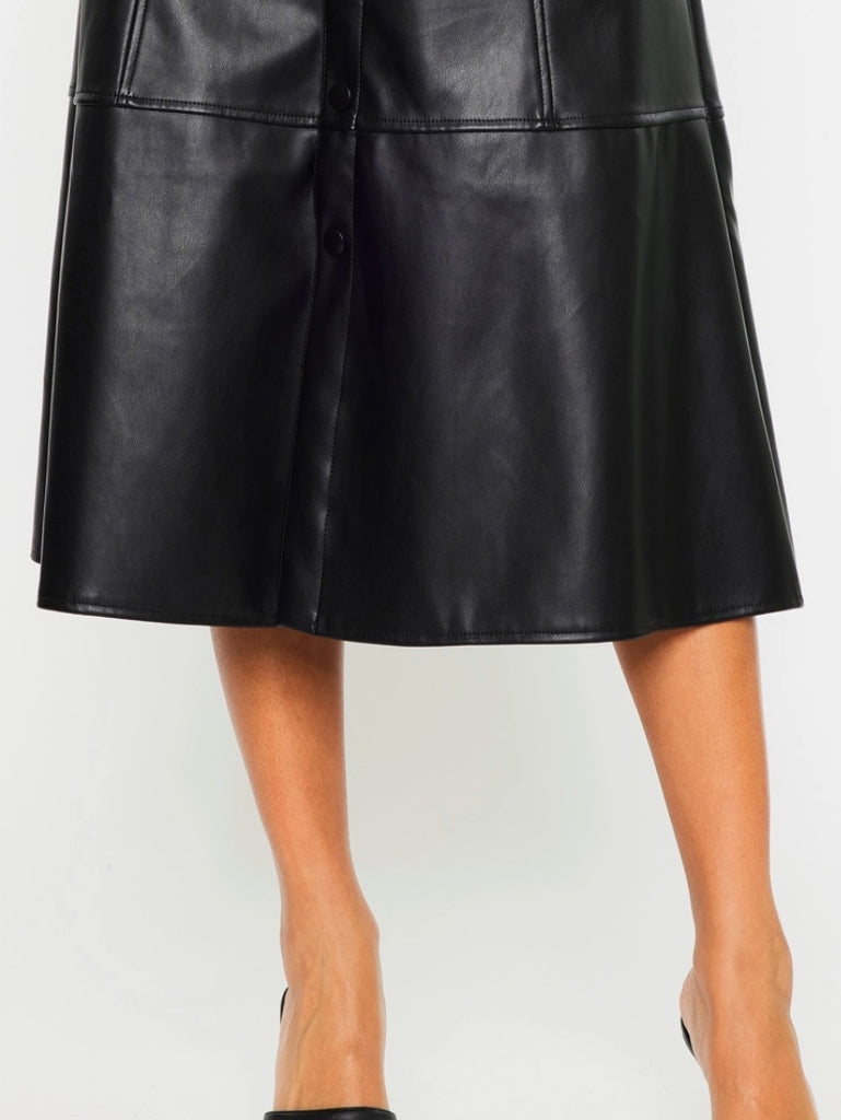 Black Faux -Leather Skirt features a high waistline, Exposed Snap Button Closure, the length of the skirt falls to the floor.