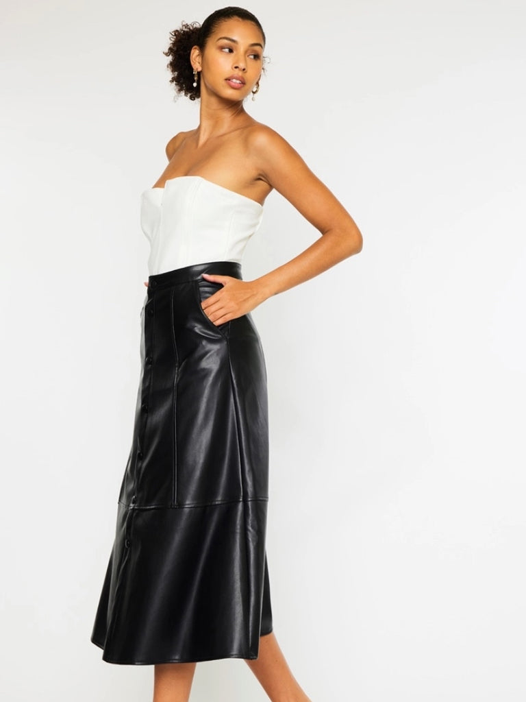 Black Faux -Leather Skirt features a high waistline, Exposed Snap Button Closure, the length of the skirt falls to the floor, and has handy pockets.