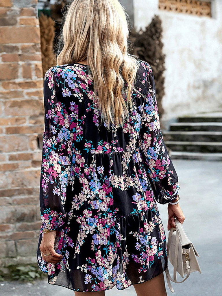 Black Midi -Length Floral Dress with purple and pink and white flowers has puff sleeves and high waist , with a smocked neckline .