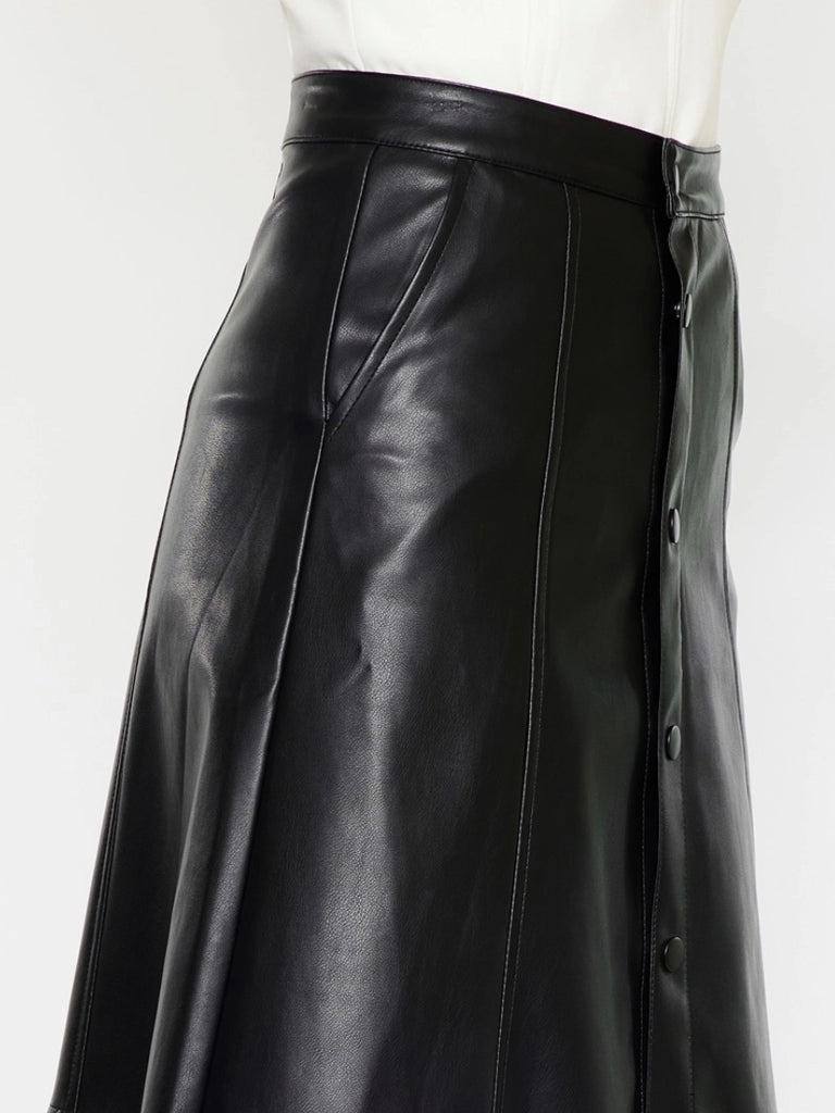 Black Faux -Leather Skirt features a high waistline, Exposed Snap Button Closure, the length of the skirt falls to the floor.