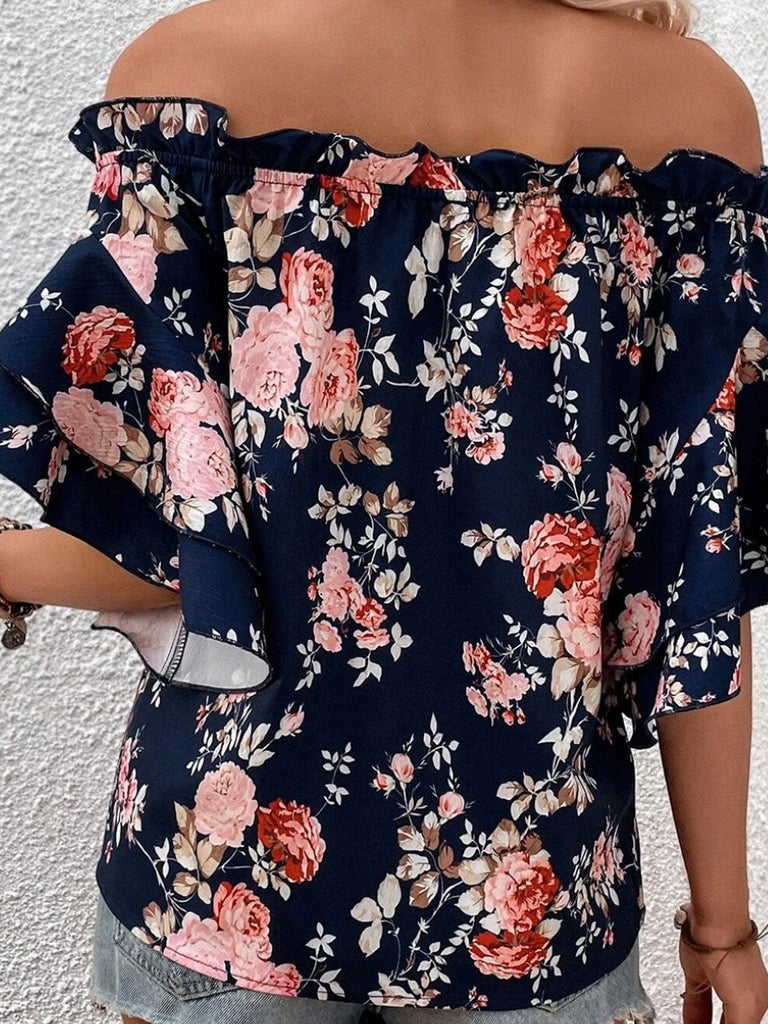 Turn heads in this off the shoulder Blue Floral Top,  with ruffle detail and roomy flounce sleeves.