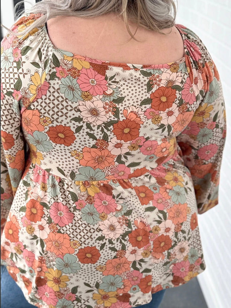 Floral Babydoll blouse, square neck design and stylish peplum silhouette.