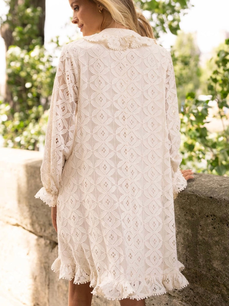 Cream Lace Midi Dress featuring a frilly collar and buttons, long ruffle sleeves, and a flared cut with ruffle details at the bottom.