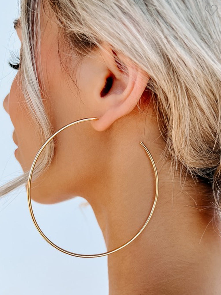  Gold Hoop Earrings, Featuring a large hoop detail , and are made with made with iron and brass.