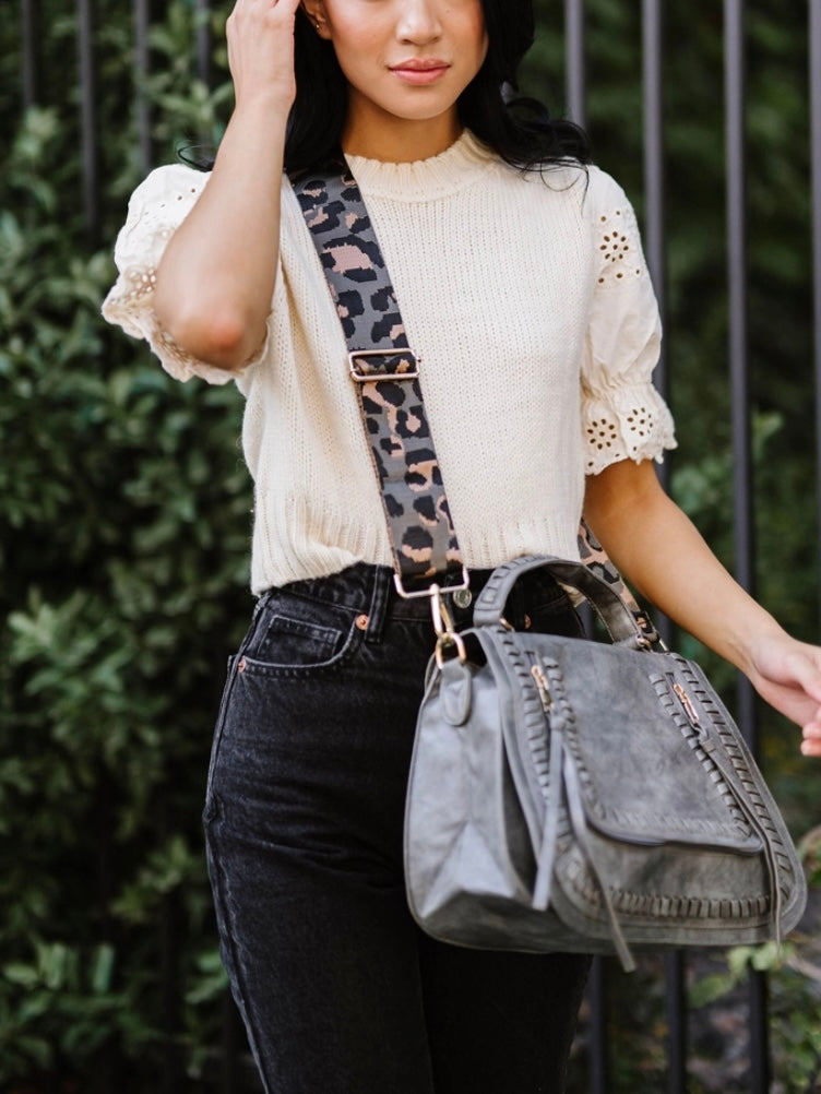 Grey Vegan Purse with Leopard Strap, 2 zippered front pockets and gold hardware.