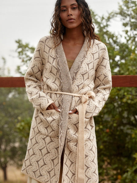 Creamy Natural Toned Cardigan features a western diamond print, long sleeves, and patch pockets, with a  waist belt.