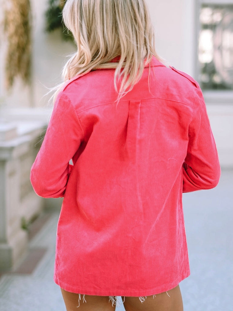 Bright pink corduroy shacket features a button front and front pockets.