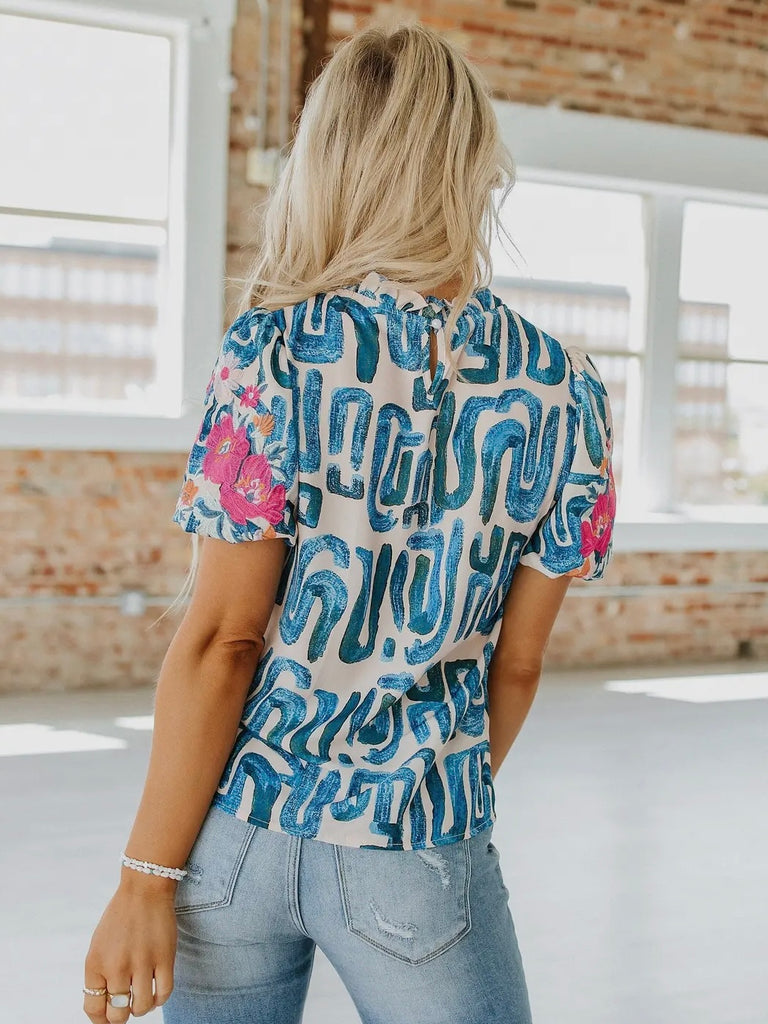 Beige and Blue printed Puff Sleeve Top featuring Pink embroidered flower design and frilled neck.