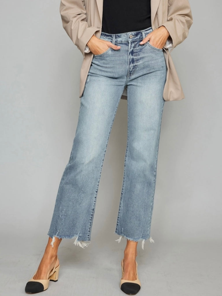 High Rise Slim Wide Leg Jeans lighter fading and whiskering, features a 5-pocket style , single front button closure, and zip fly with frayed hem.