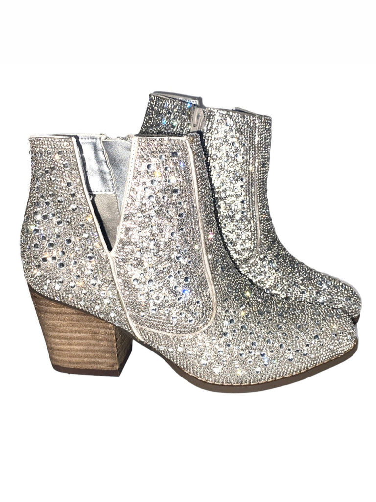 Silver western-style booties are adorned with dazzling rhinestones.