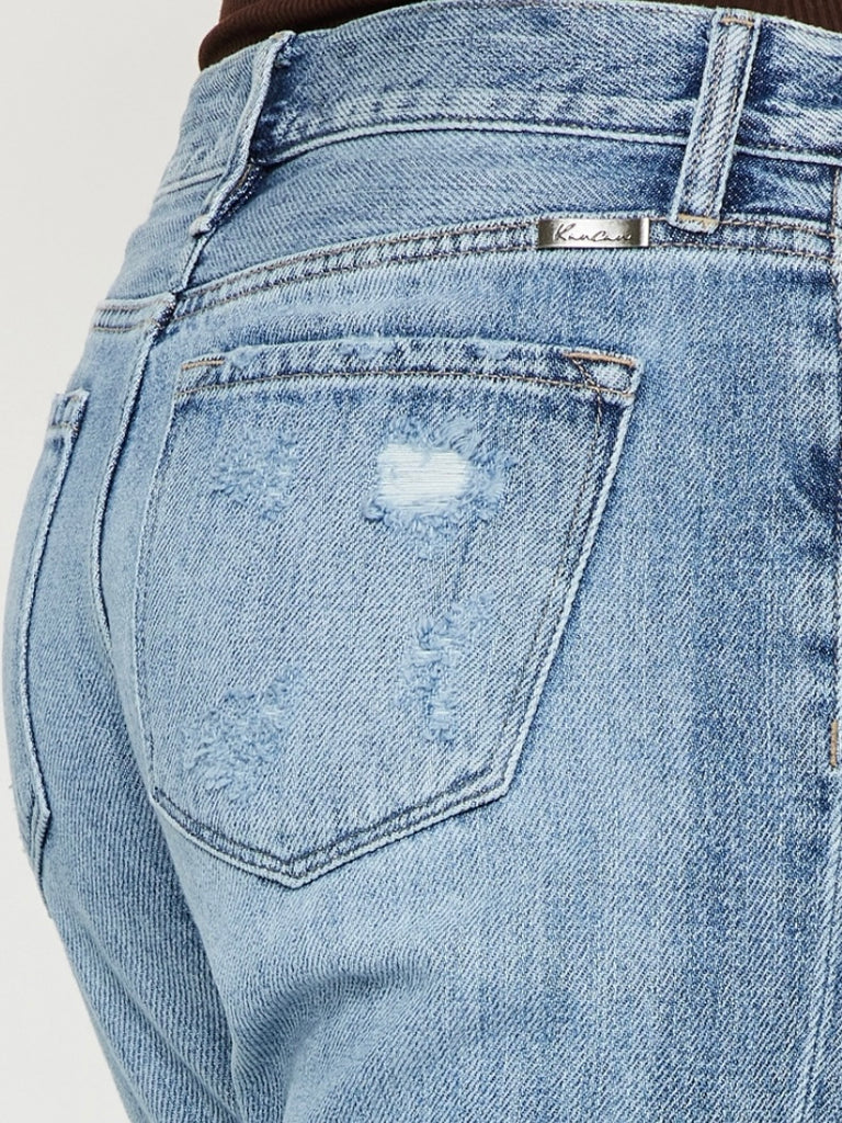 High Waisted ,5 Pocket Single Button Front and zip-fly Jean, with Light Fading and 3d Whisker detail , and moderate destruction with patches on both legs .