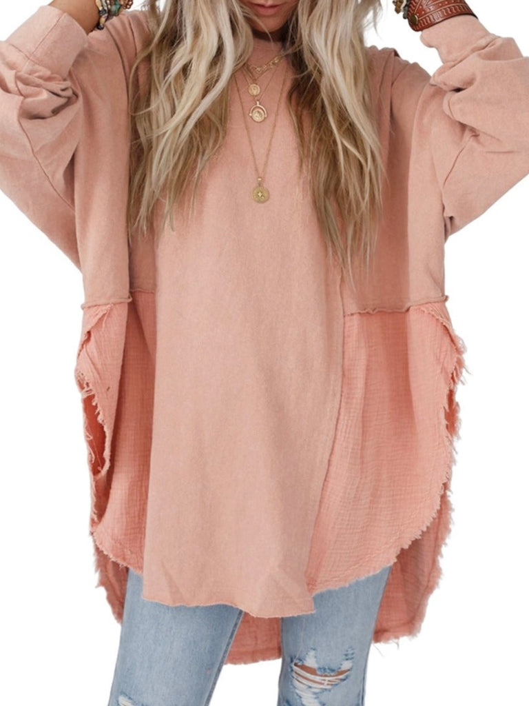 Pink Colour high-low tunic length and split hem pullover, features a round neckline and long sleeves, blend of crinkled gauze and knit, and raw edge design.