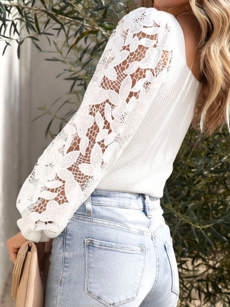 back view of white knit sweater with lave sleeves