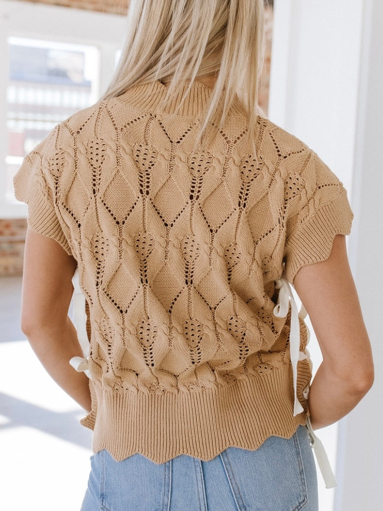 Khaki sweater with unique scalloped design and lace-up sides. Short sleeved.