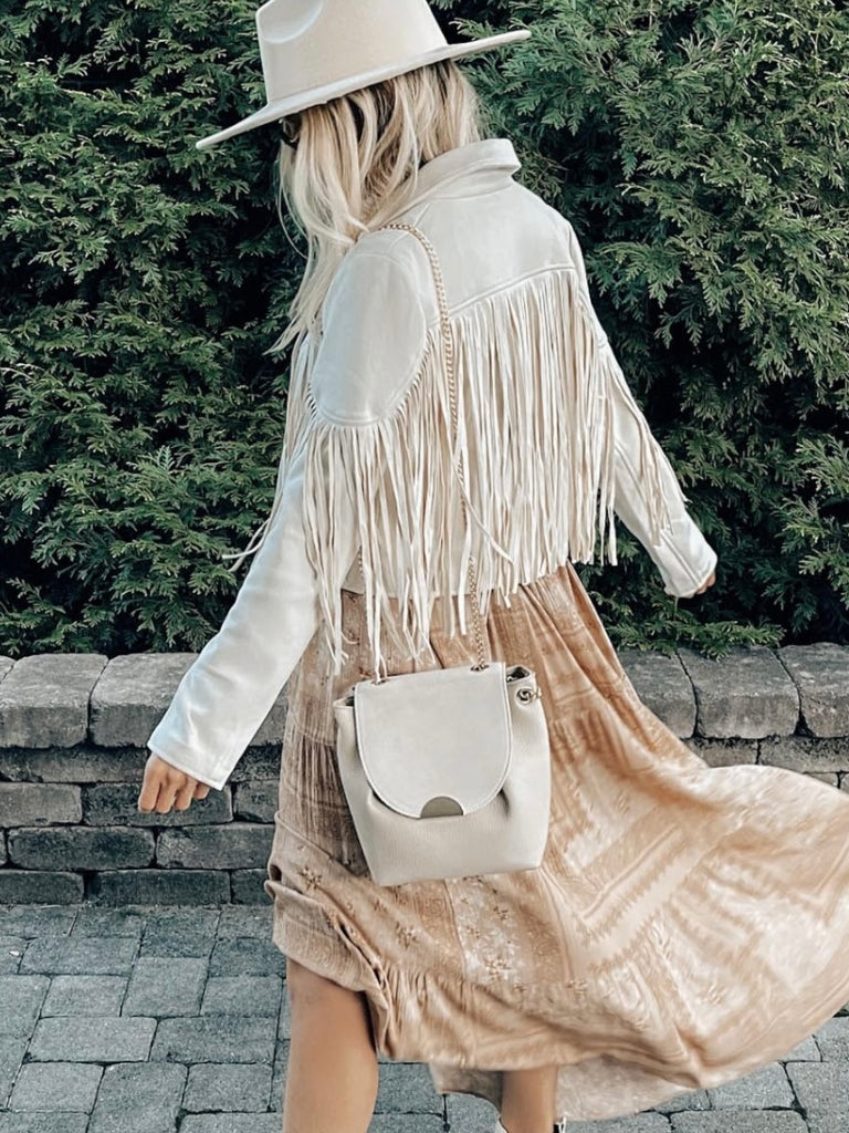 Get Fringed Boho Jacket in Cream will have heads turning. Crafted with premium grade faux suede and fully lined for the ultimate comfort.