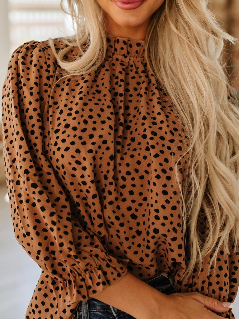 3/4 Sleeve Cheetah Print Top with high neck and bubble sleeve in brown.