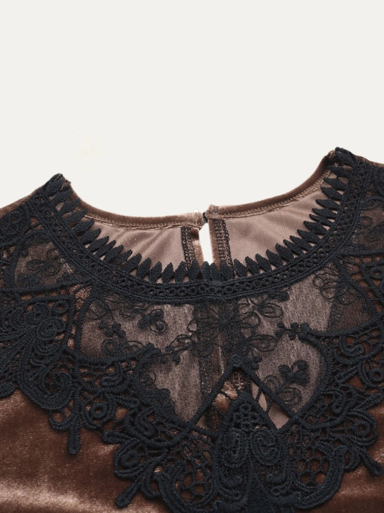 Coffee Brown Velvet Blouse , features a crochet lace pattern, rounded neckline, and long sleeves and a relaxed bodice that features a button at the back and a keyhole .