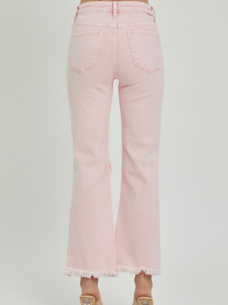 Acid Pink Jeans. Cropped length, distressed knees and frayed hemline.